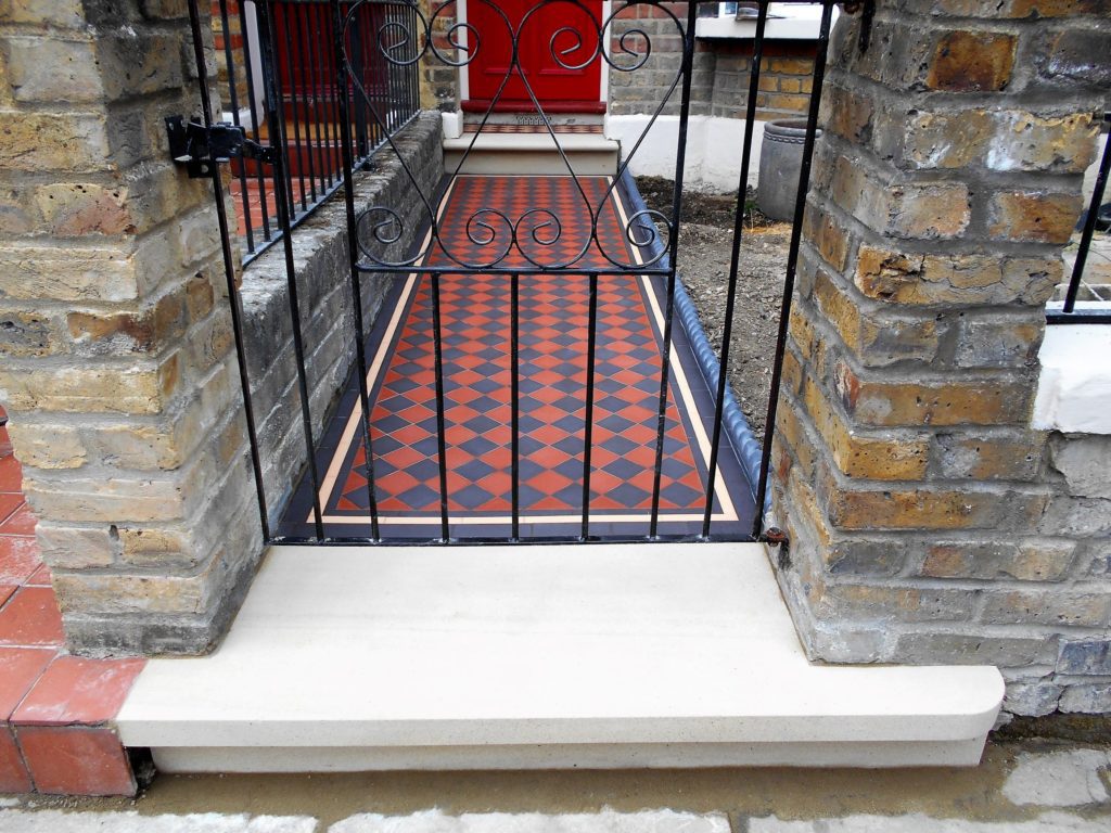 red, black and cream tiles on Victorian pathway installation in Ealing