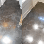 dark hexagon black cement encaustic tiles with bleach and etching damage on bathroom floor. Tiles have been restored and look very good in this before and after pic'