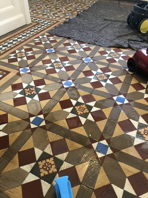 Victorian hallway tiles in Radlett that are being cleaned. 