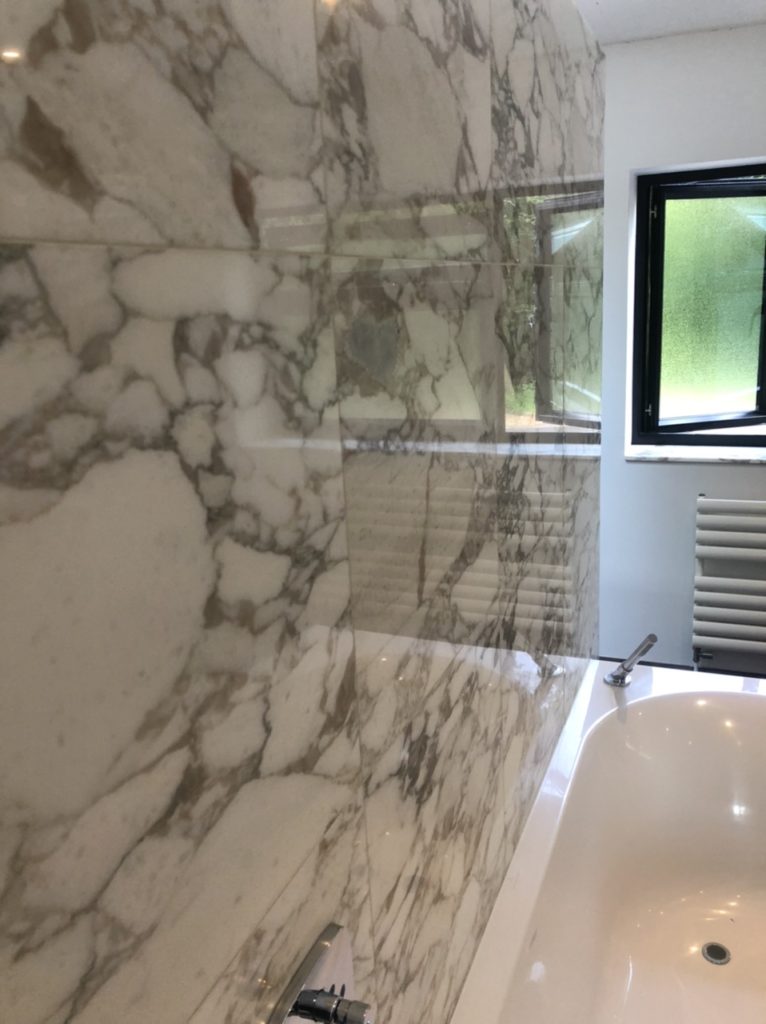 Marble back wall to bath that we polished and cleaned