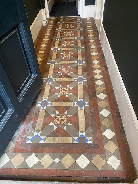 dirty Victorian hallway tiles before cleaning