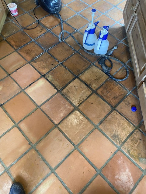 The terracotta tiles that have been half cleaned.You can see the dramatic difference between dirty and clean tiles