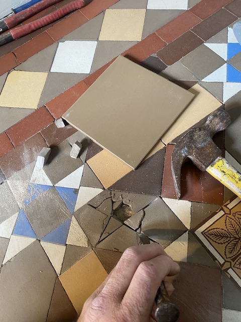 replacing damaged and broken Victorian hallway tiles with new reproduction ones