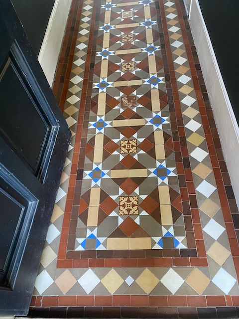 The finished Victorian tiled hallway after waxing and buffing with traditional bees wax