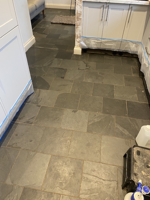slate kitchen floor tiles in a dirty state full of grease and grime