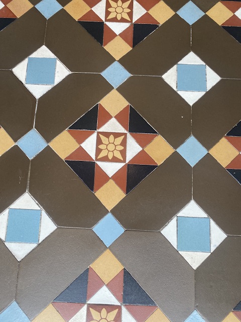 Victorian geometric tiles close up showing all the colors clearly