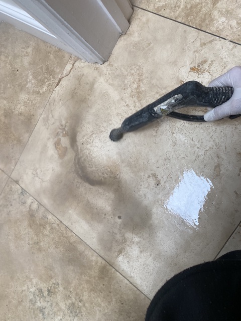 travertine stone tiles being steam cleaned makes dirty sludge appear