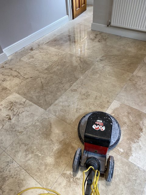 travertine stone tiles being buffed