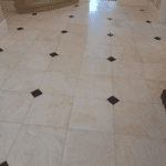 original cream coloured marble tiles with black centre small squares polished to natural shine in property near Waltham Cross Cheshunt