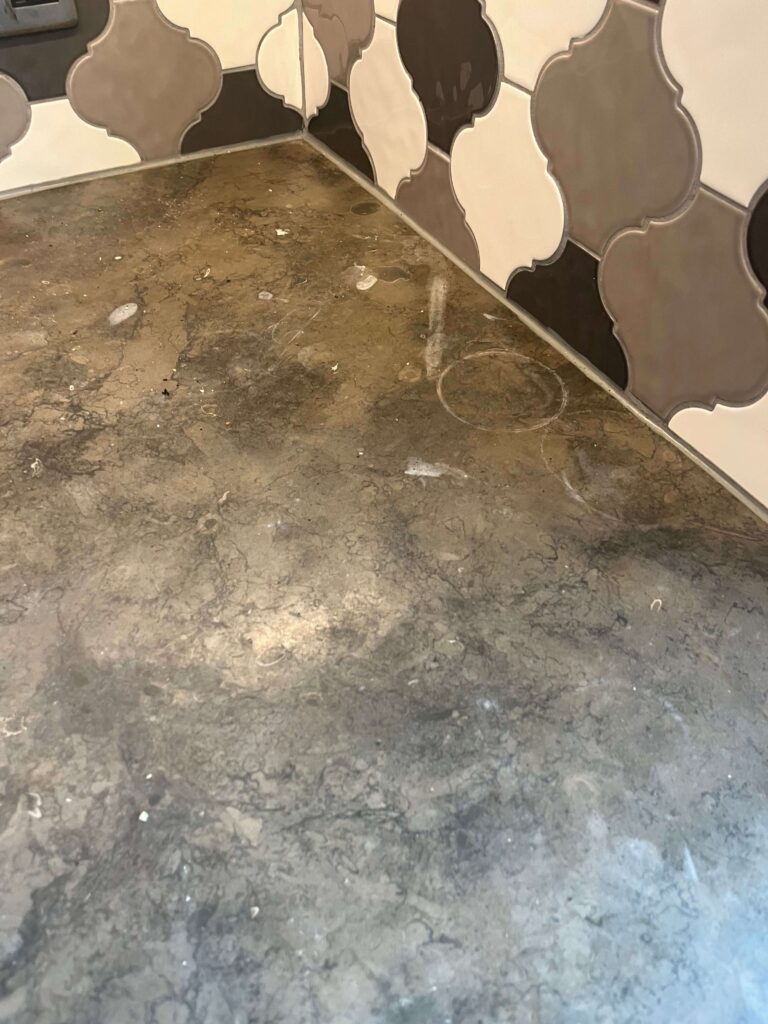 etched and damaged limestone marble kitchen work surface. Caused from acidic everyday products in kitchen