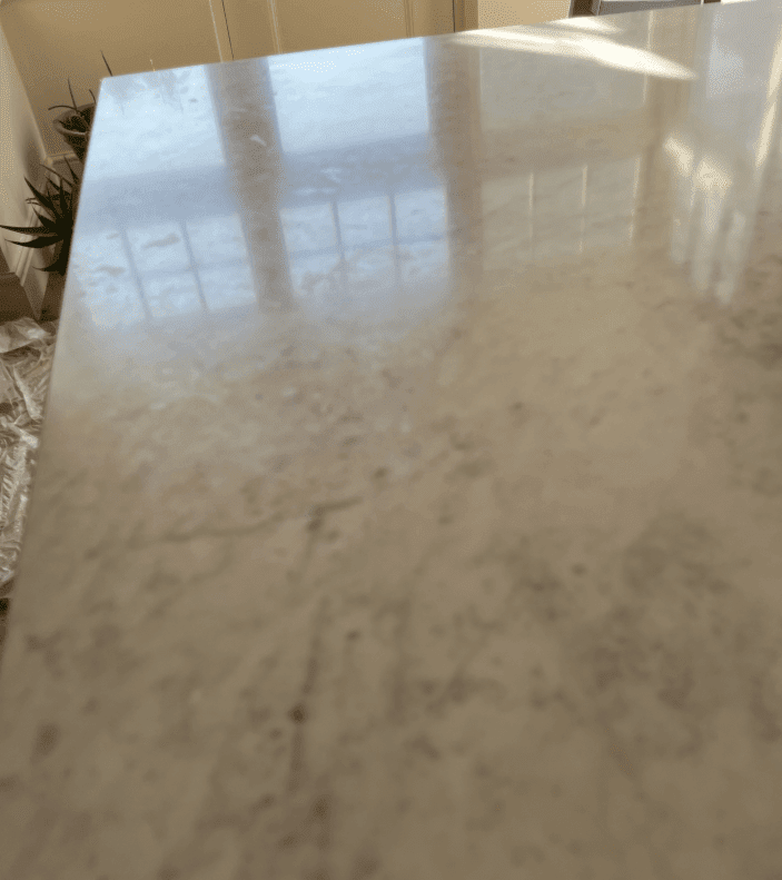 engineered Carrara quartz worktops with etching and heat damage